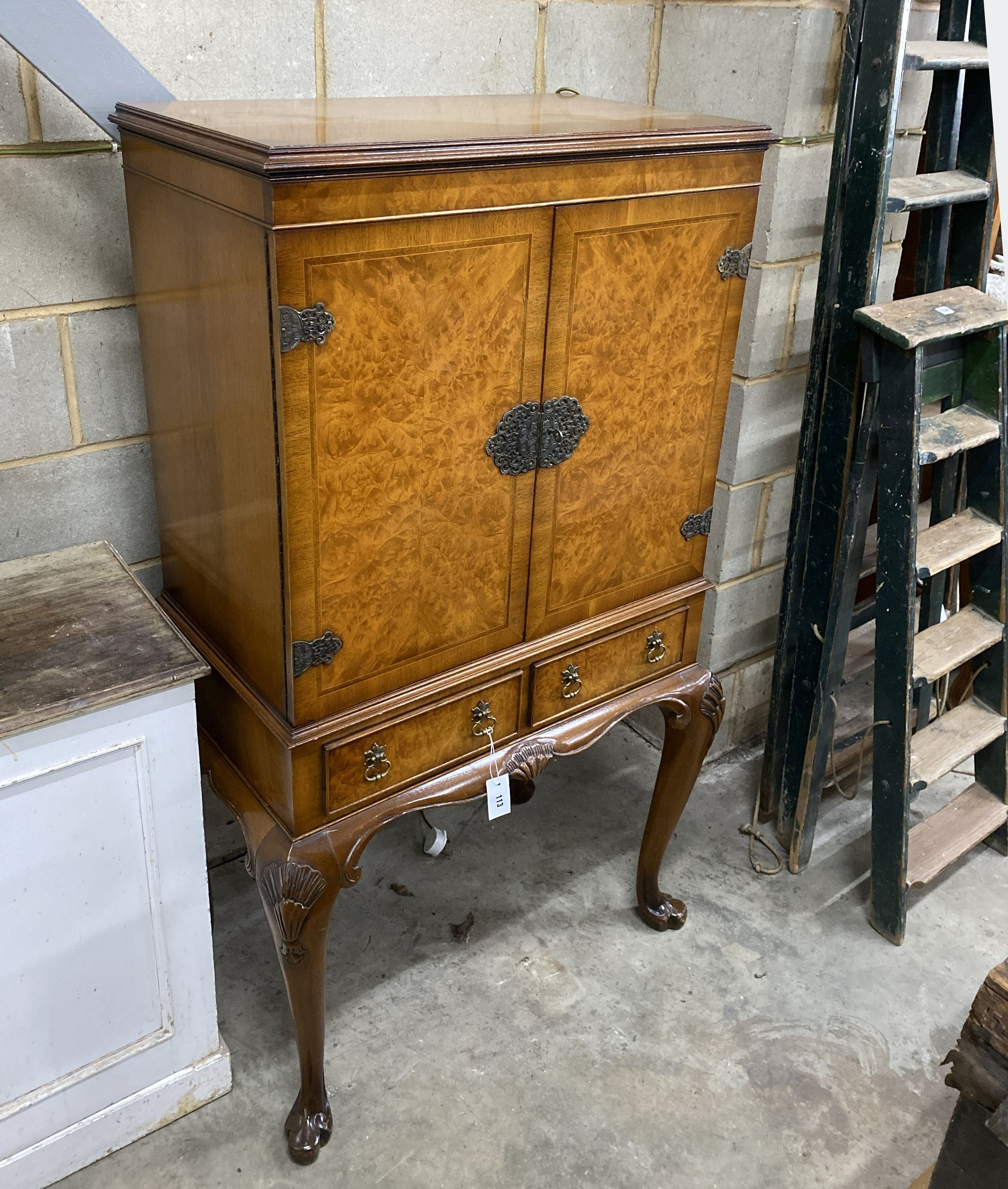 A Queen Anne style walnut cocktail cabinet, width 84cm, depth 52cm, height 147cm